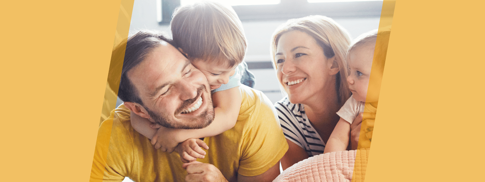 Family of four laughing together