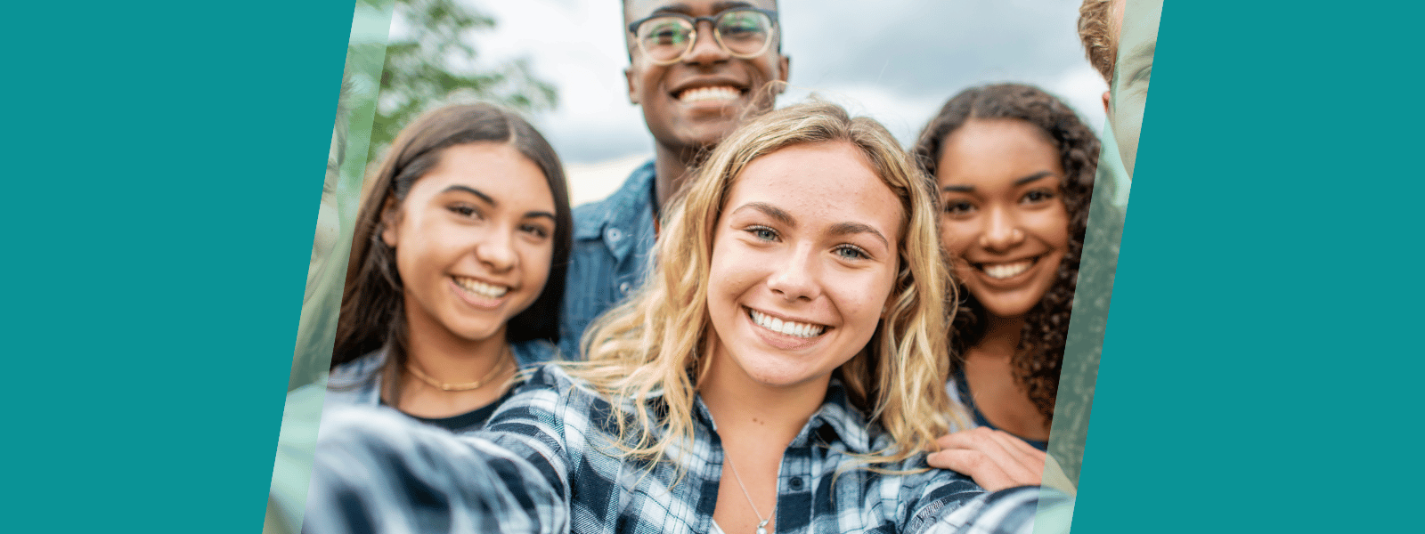 Group of young adults smiling at the camera