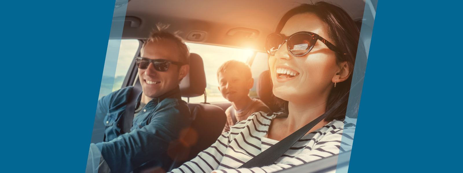 Happy family driving in car