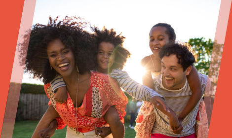 Family of four in backyard, having fun