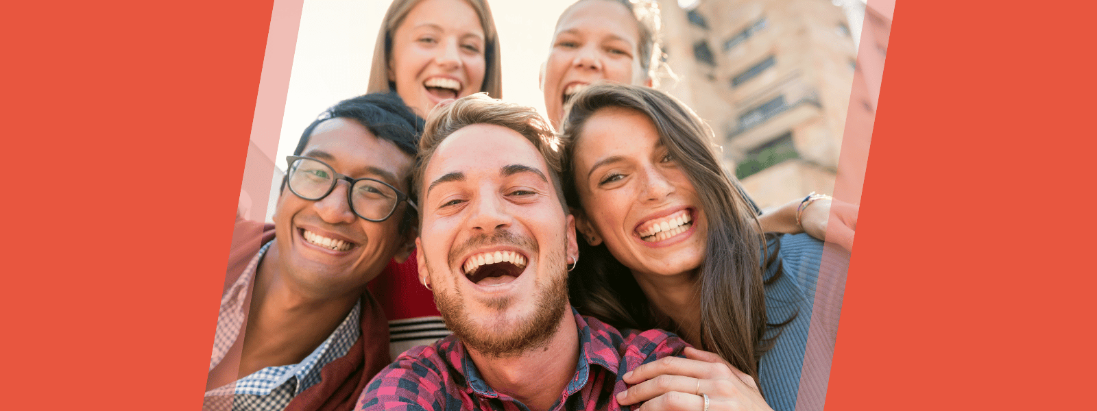 Group of young adults smiling at the camera