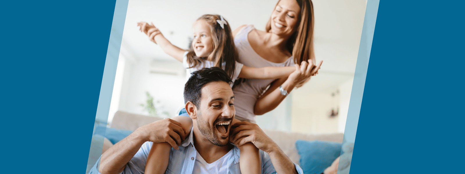 Family of three laughing at home