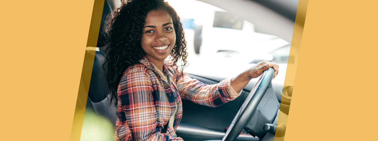 Young driver at the wheel of a new car