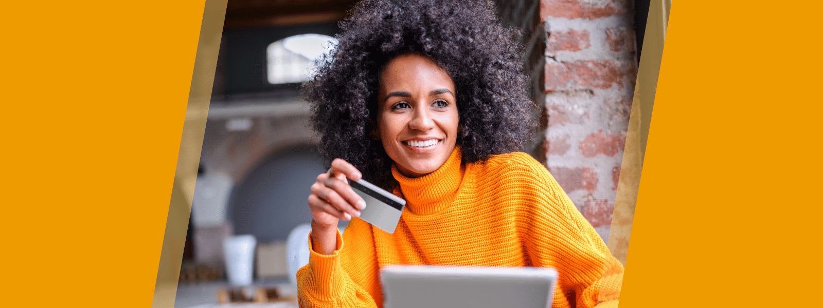 Woman in a cafe with a card for payment