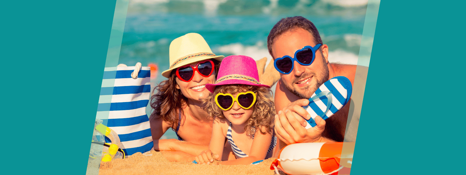 Family of three at the beach with fun sunglasses