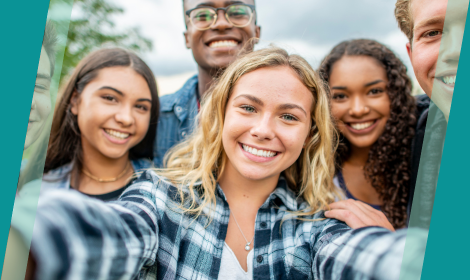 Students gather in a camera selfie