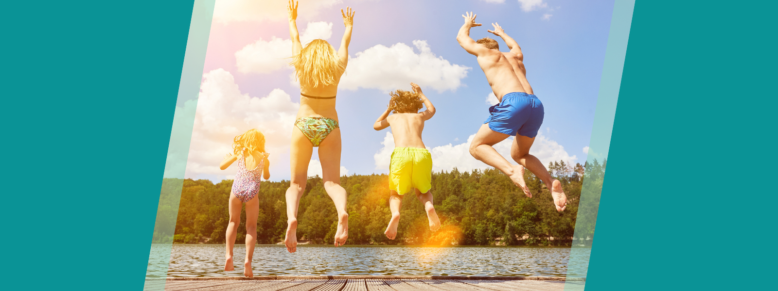 Family of four jumping into water on vacation