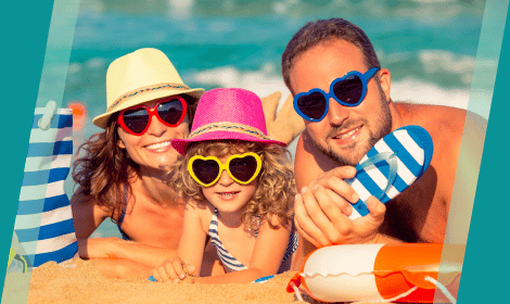 Family at the beach with fun sunglasses