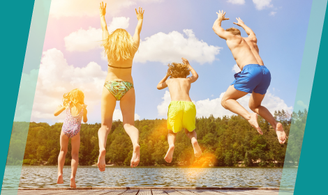 Family of four jumping into the water